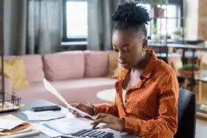 Blackwoman Calculating Tax Bill